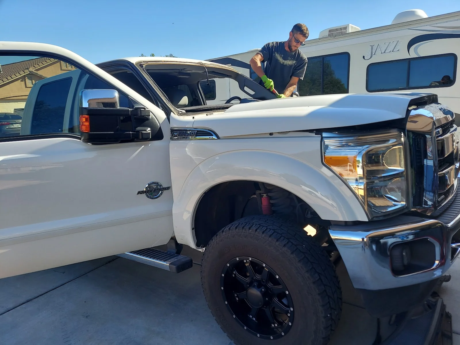 John mid-install on a customer's truck windshield — Kingman, AZ